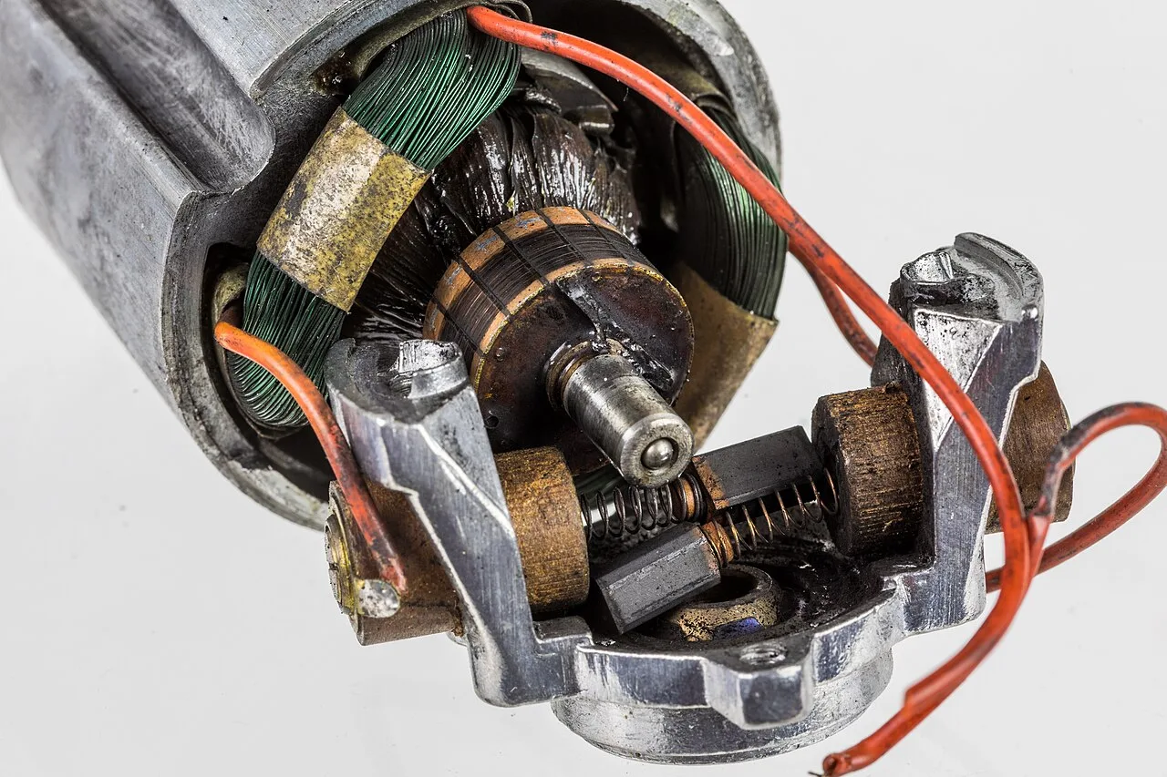 Disassembled electric motor showing the windings, rotor and metal parts