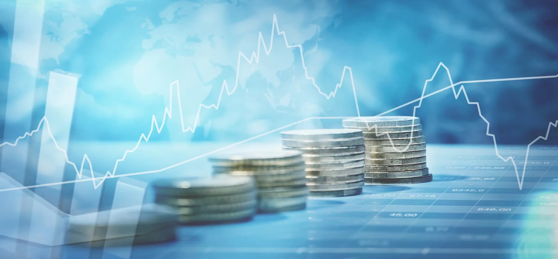 Stock market screens displaying blue charts and candlesticks - financial markets