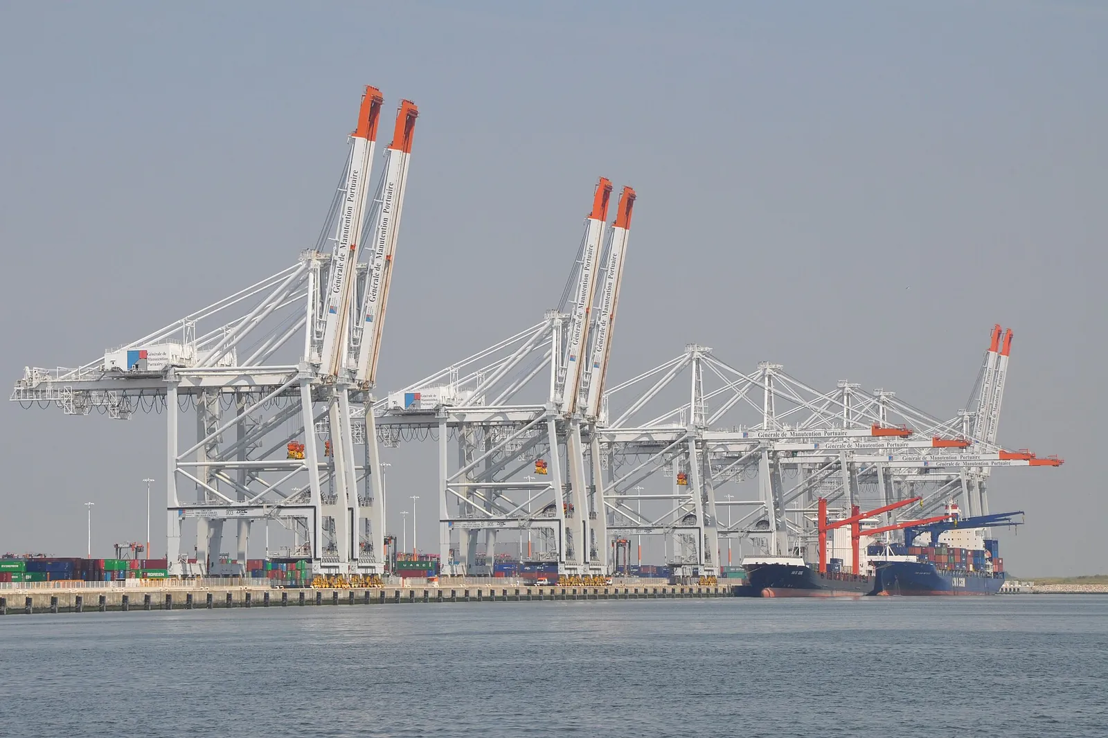 Container gantry cranes at the Port 2000 terminal in Le Havre, beside the water