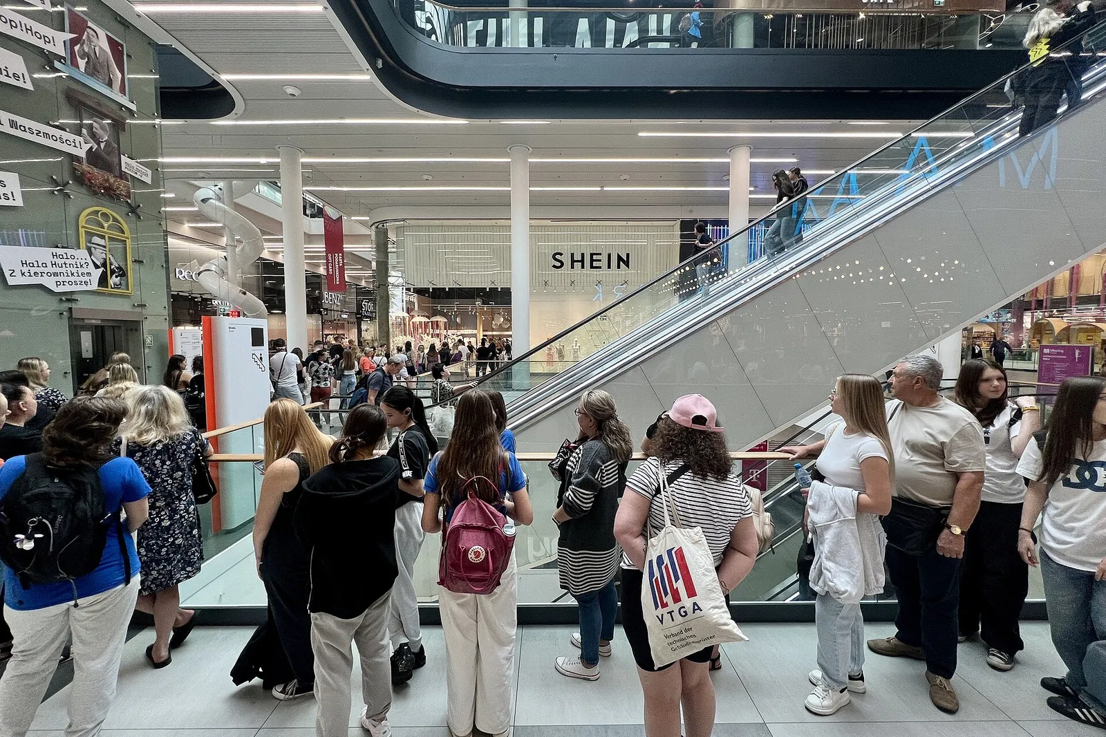 Long queue of customers outside the Shein shop in a shopping centre in Warsaw