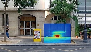Thermal camera image of a ground-floor air conditioner expelling hot air at 47 °C into public space