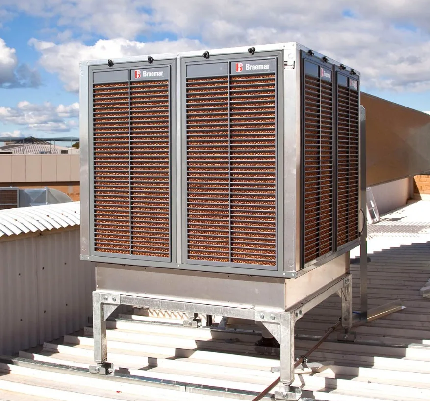 Industrial evaporative cooler installed on the roof of a commercial building