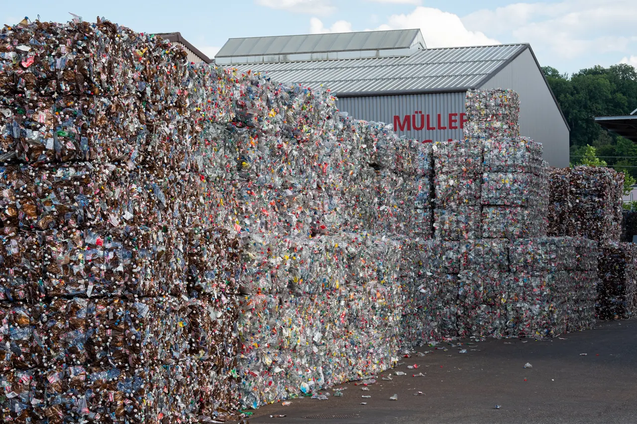 Crushed PET bottle bales stacked in front of a recycling centre in Frauenfeld, Switzerland