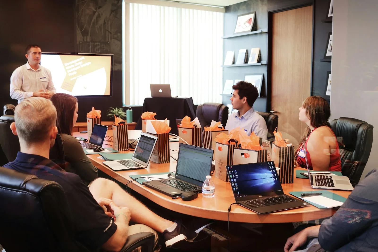 Team in a scoping meeting around a table: choosing a carbon accounting methodology