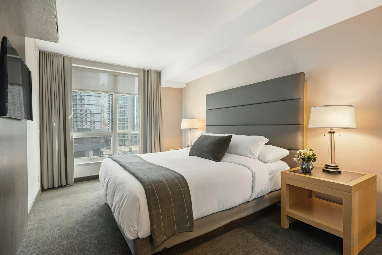 Bedroom with white bedding - the finished product consumers see, rather than the 444 kg of CO₂ they do not see