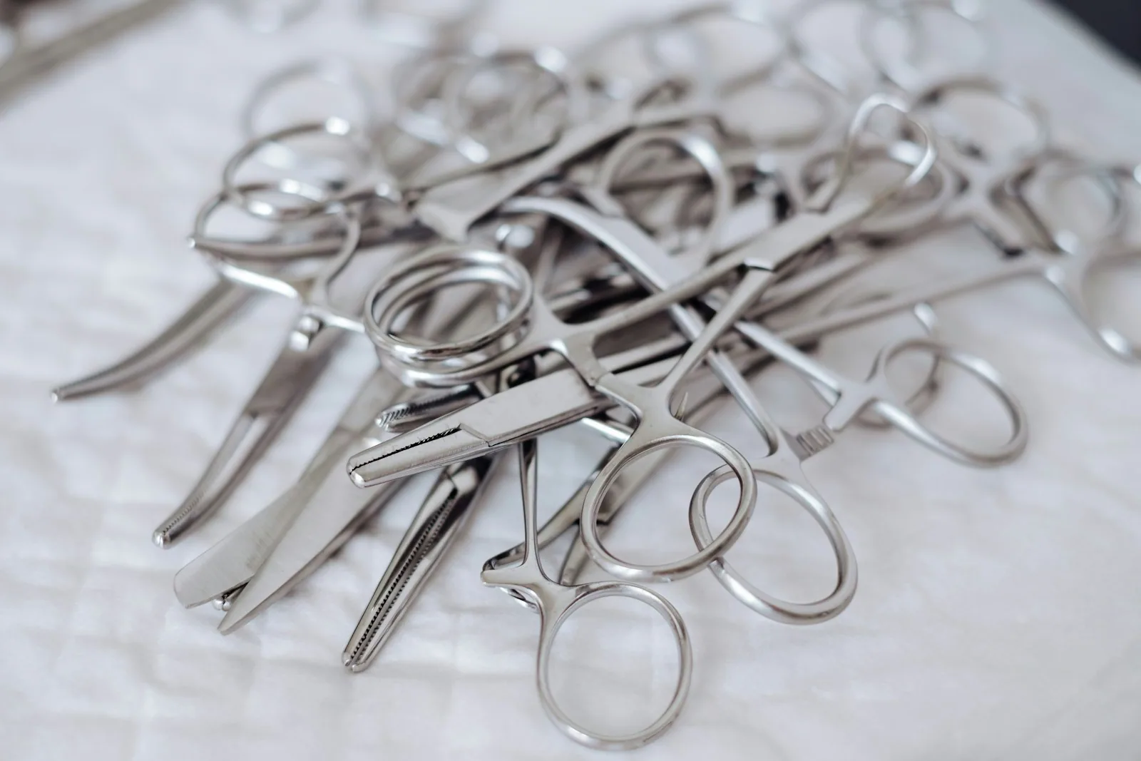 Stainless steel surgical instruments on a sterile tray - products whose every component has a measurable footprint